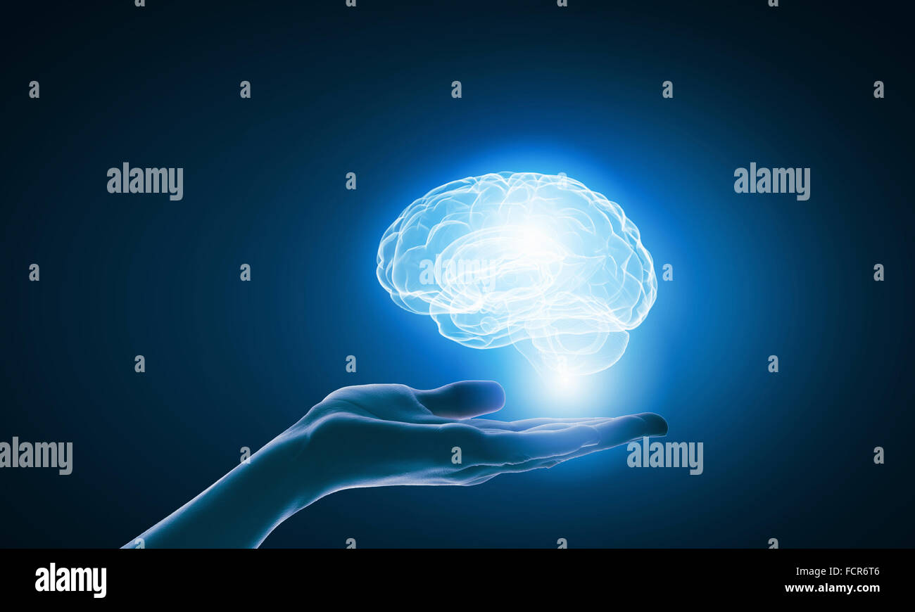 Close up of businessman holding digital image of brain in palm Stock ...