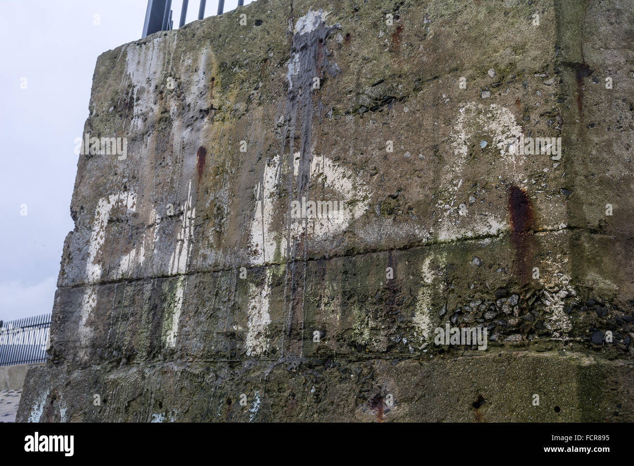 Old faded PIRA graffiti near Newcastle, County Down in Ireland Stock Photo