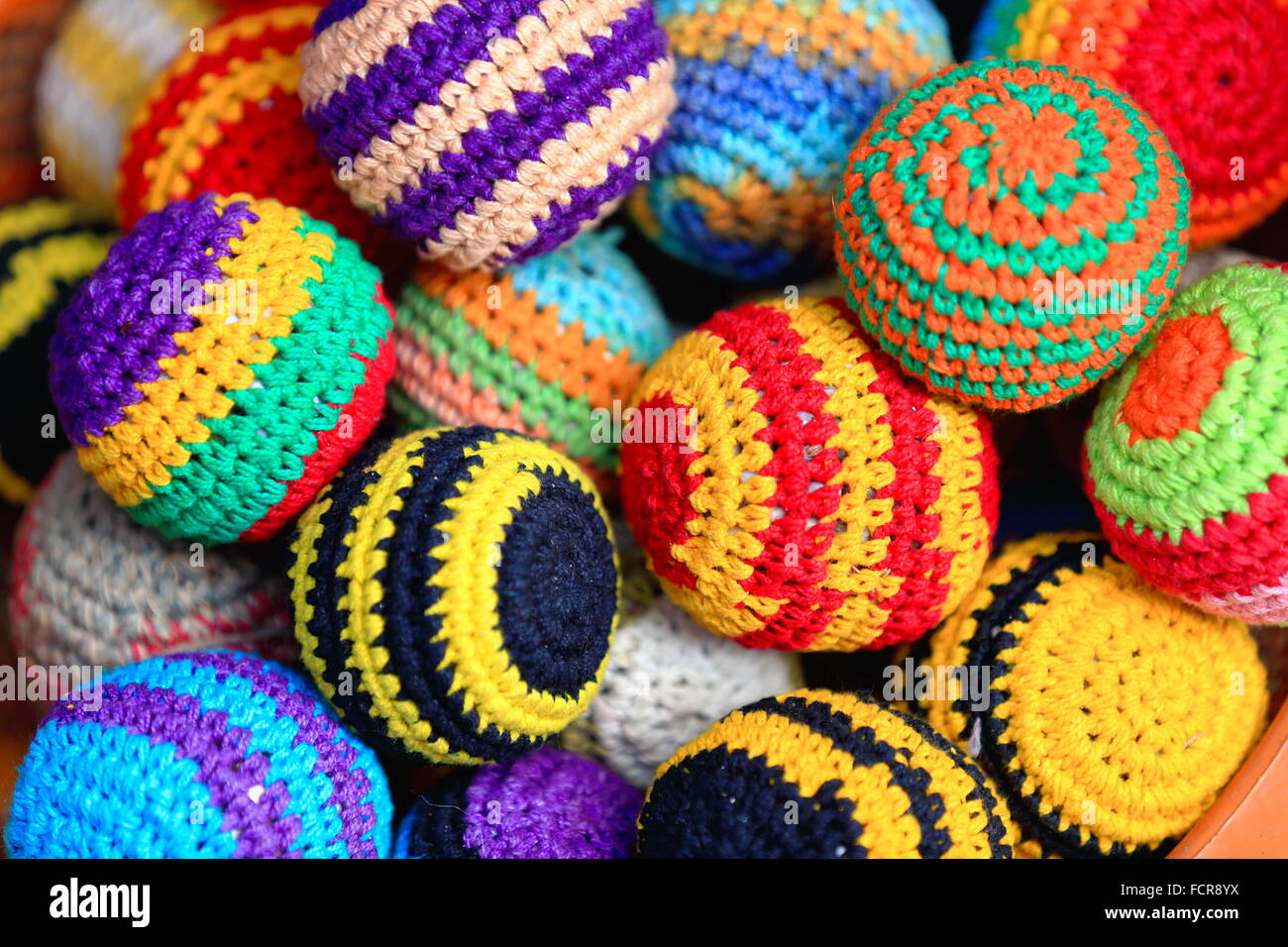 Typical nepalese hand made manycolored crochet woolen balls for sale in a souvenir shop of the