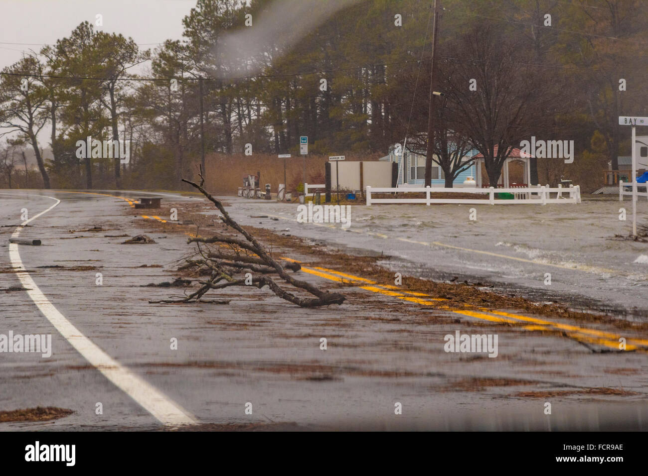 Storm ravages coastal Maryland and Delaware: Surge waters driven inland by High winds inundate neighborhoods, waves break across roads and lawns along Long Neck Road, Millsboro Delaware. Stock Photo