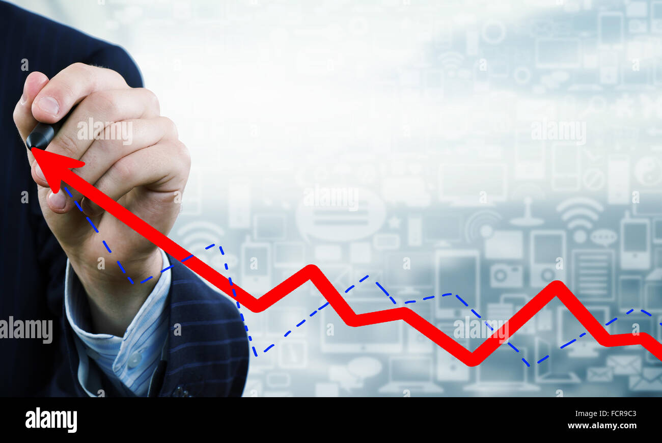 Close up of businessman drawing increasing graph with marker on media ...