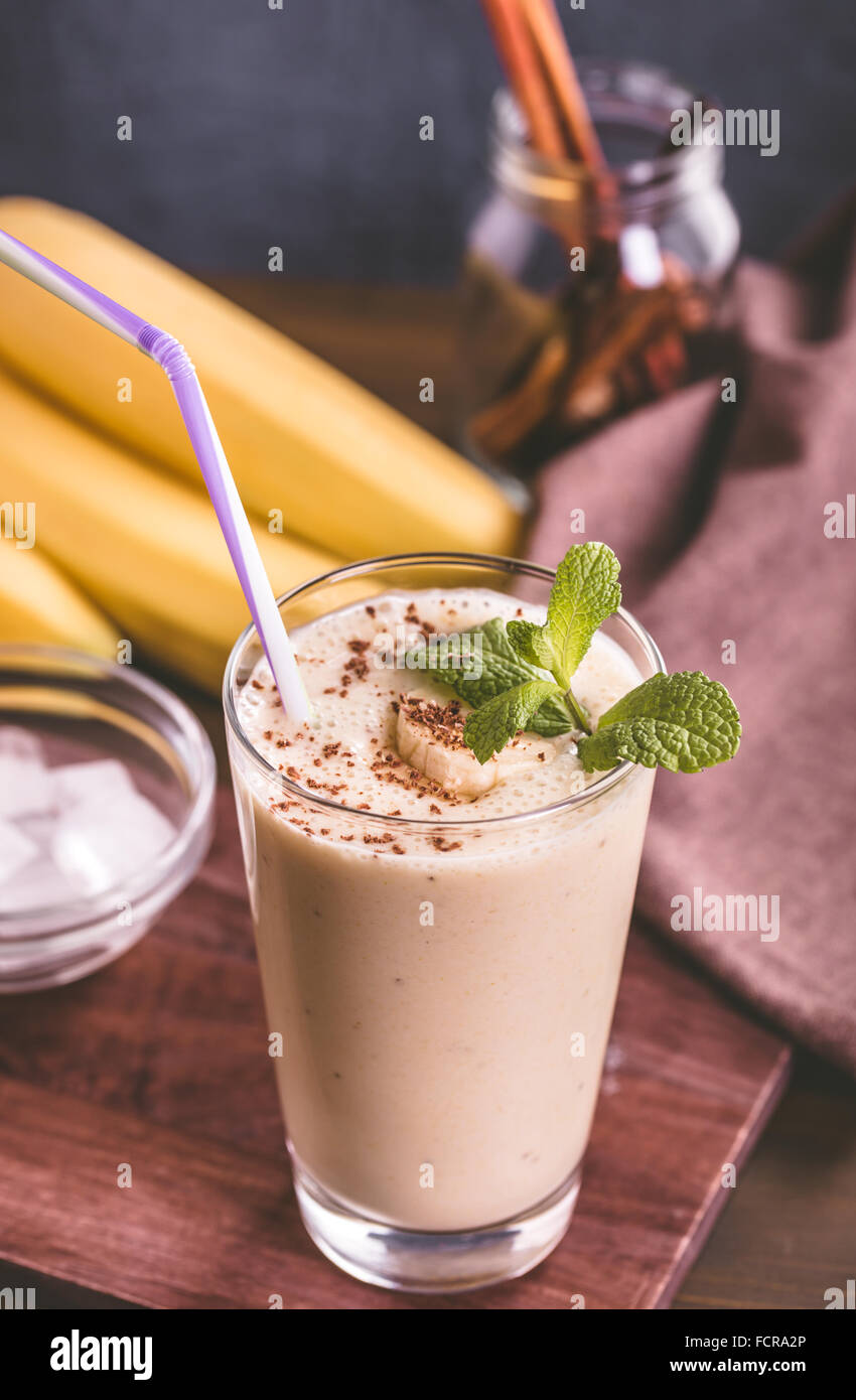 Banana smoothie on wooden table Stock Photo