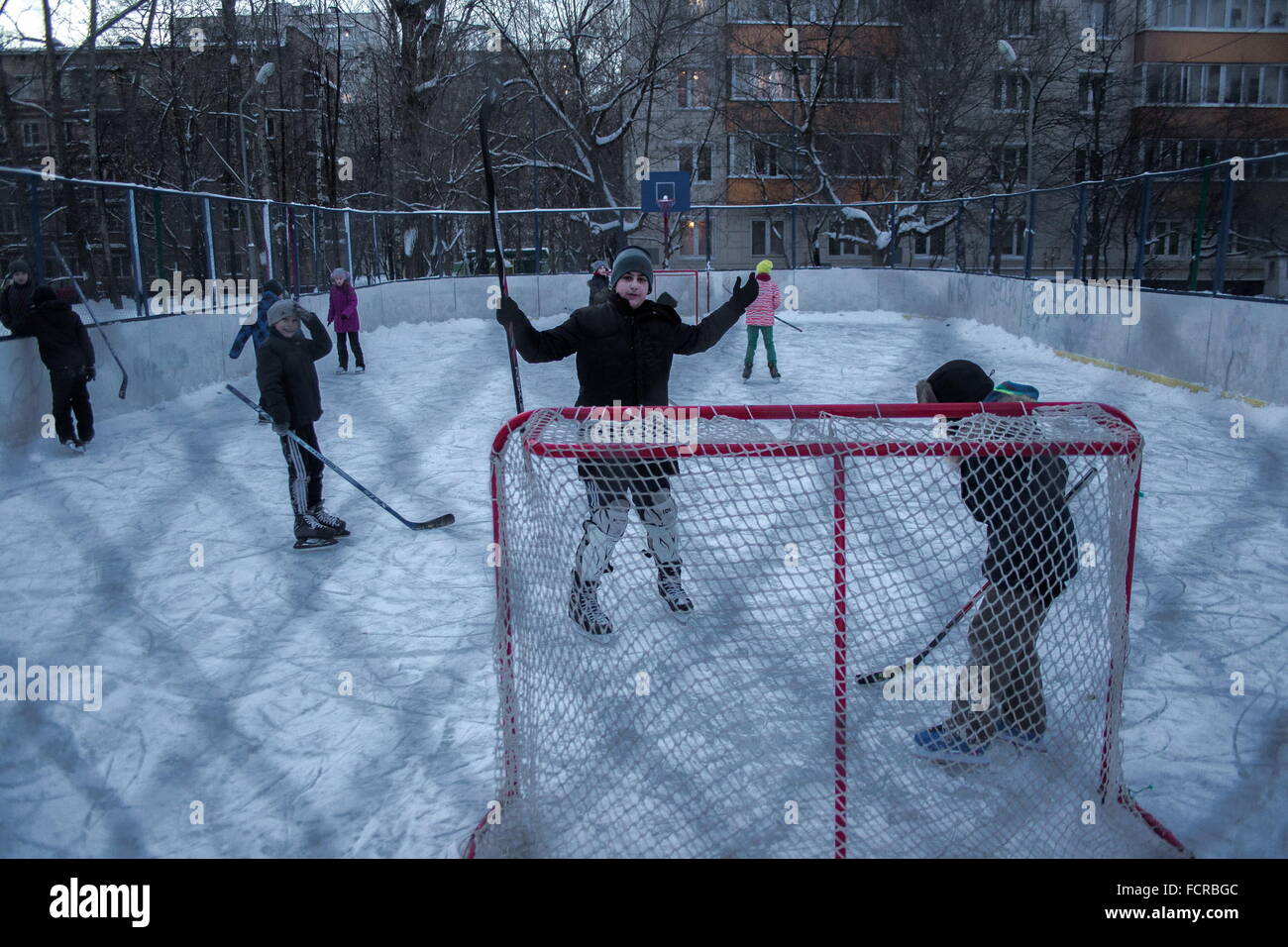 Moscow. 24th Jan, 2016. Kids play hockey in playground in Moscow, Russia, on Jan. 24, 2016. © Xinhua/Alamy Live News Stock Photo