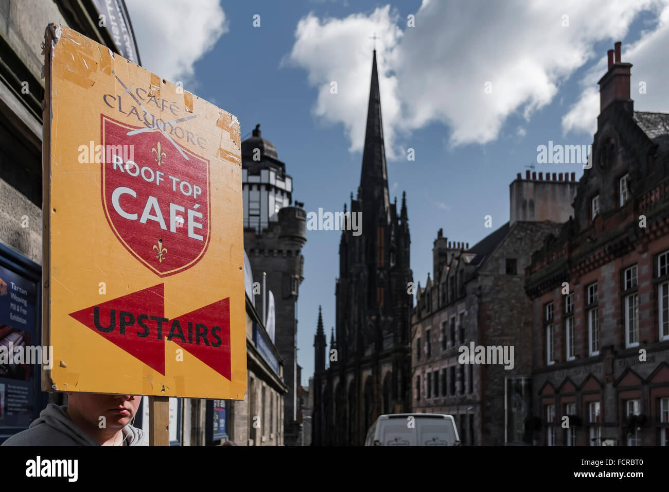 Advertising, Sign,Statue, sculpture, monument, Castle Rock, clouds, blue sky, Castle, City of Edinburgh, Firth of Forth, UK, Stock Photo