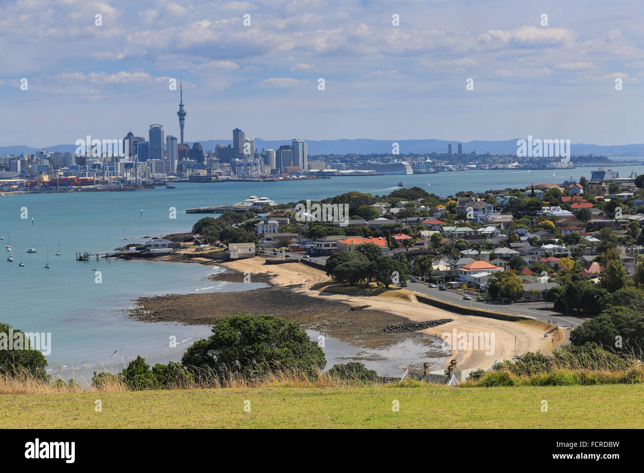 View of Torpedo Bay at Devonport and the Auckland city skyline from Hauraki Gulf Maritime Park, Auckland, New Zealand. Stock Photo