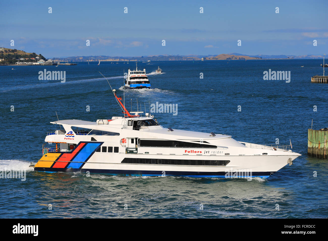 Fullers Jet Raider ferry approaching the ferry dock at Auckland, New Zealand. Stock Photo