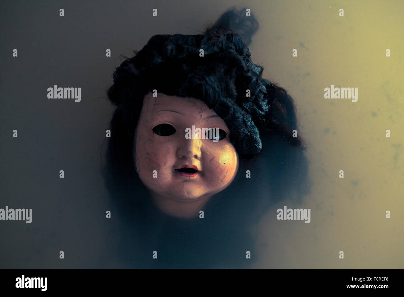 Creepy doll face Stock Photo