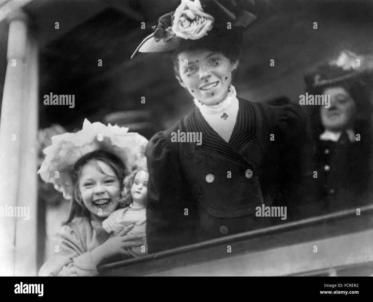 A young woman arriving at Ellis Island on the SS Baltic in 1907. One thousand single women came to New York on the ship in search of a husband. Ellis Island, New York, NY Stock Photo