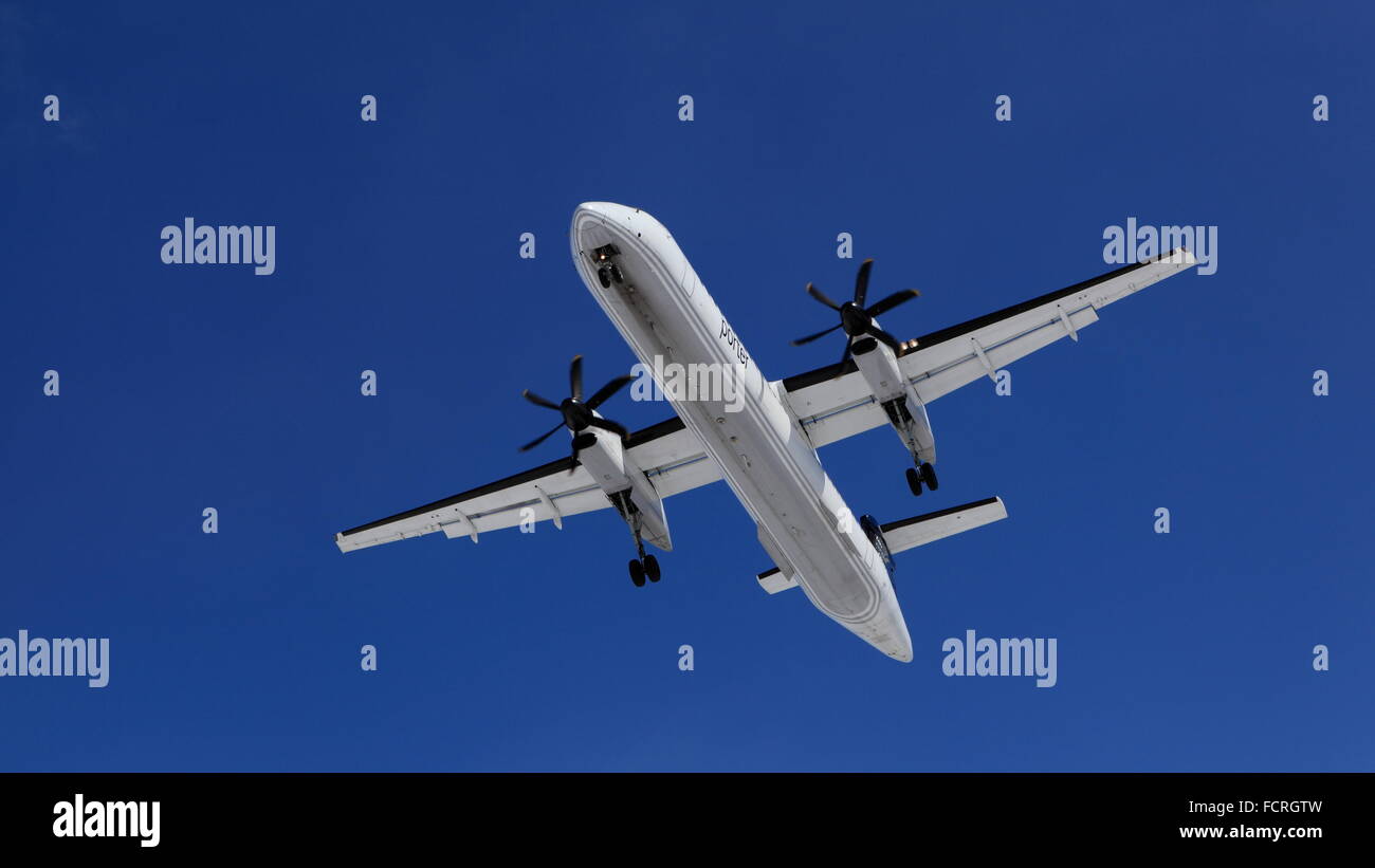 Bombardier De Havilland Canada DHC8 C-GLQD Porter Airlines on final approach at YOW Ottawa Canada, March 22, 2015 Stock Photo