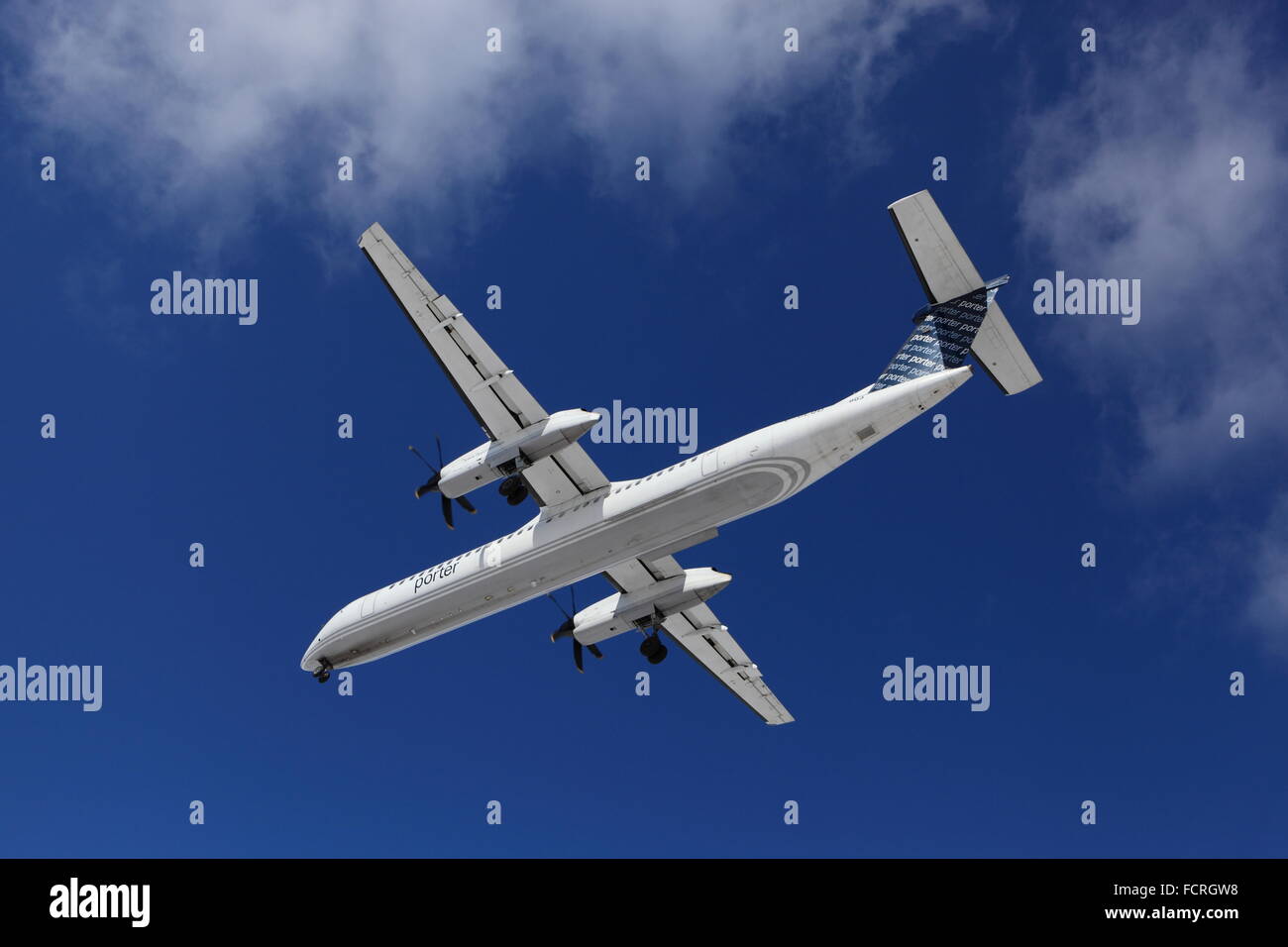 Bombardier De Havilland Canada DHC8 C-GLQD Porter Airlines on final approach at YOW Ottawa Canada, March 22, 2015 Stock Photo