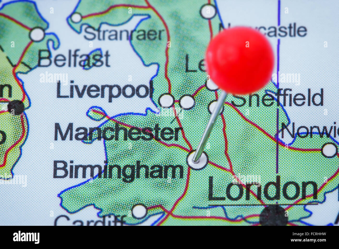 Close-up of a red pushpin in a map of Birmingham, United Kingdom. Stock Photo