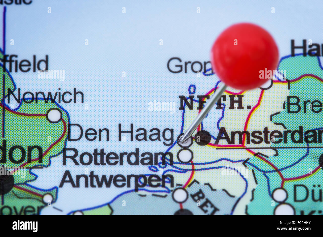 Close-up of a red pushpin in a map of Den Haag (Hague), Netherlands. Stock Photo