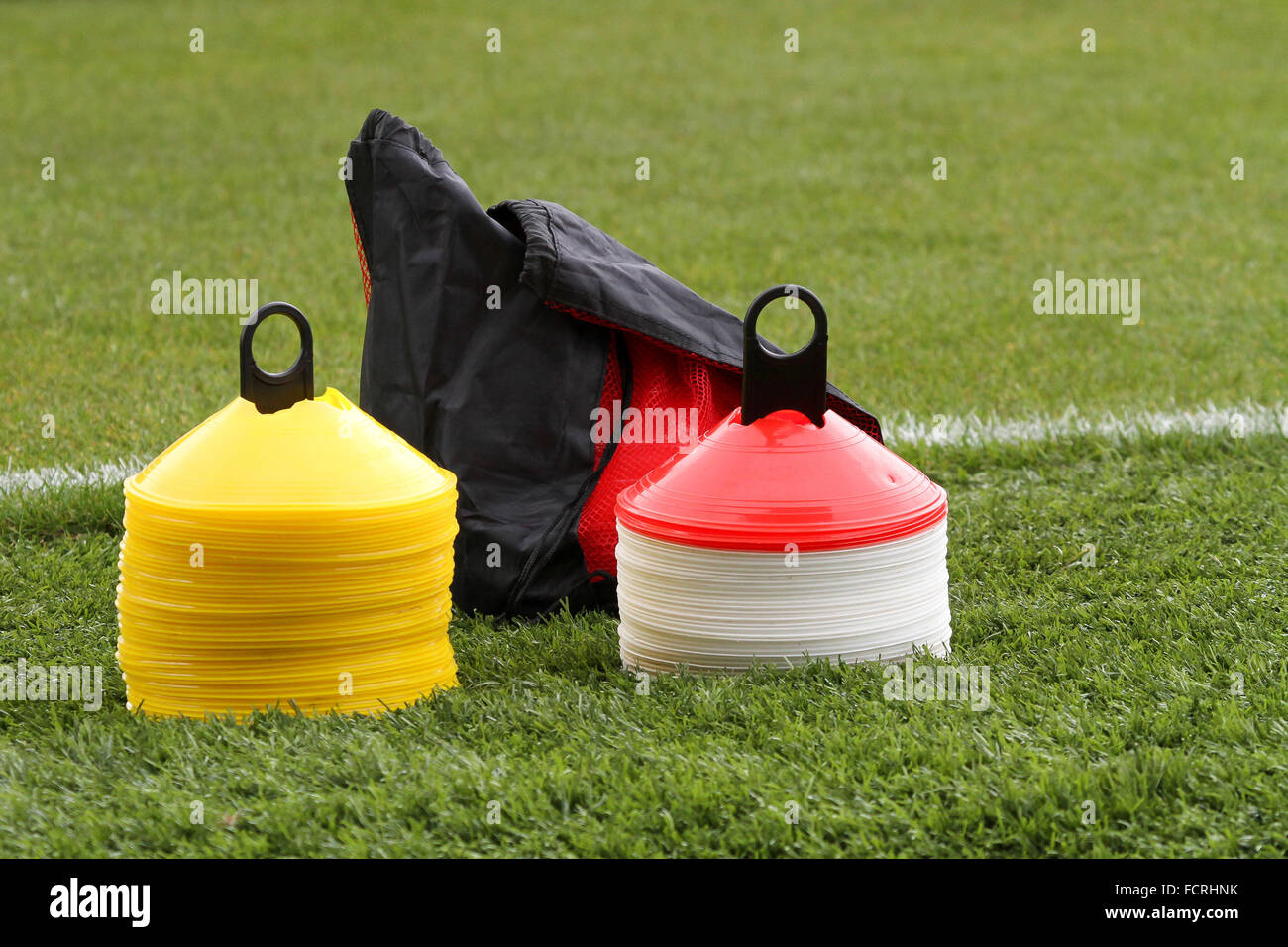 Football training cones used in training sessions and pre-match warm-ups. Stock Photo