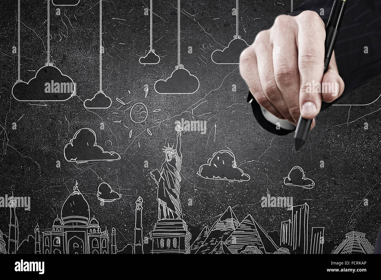 Businessman hand drawing dream travel around the world Stock Photo