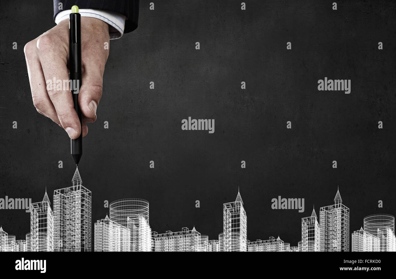 Close up of hand drawing urban buildings with marker Stock Photo Alamy