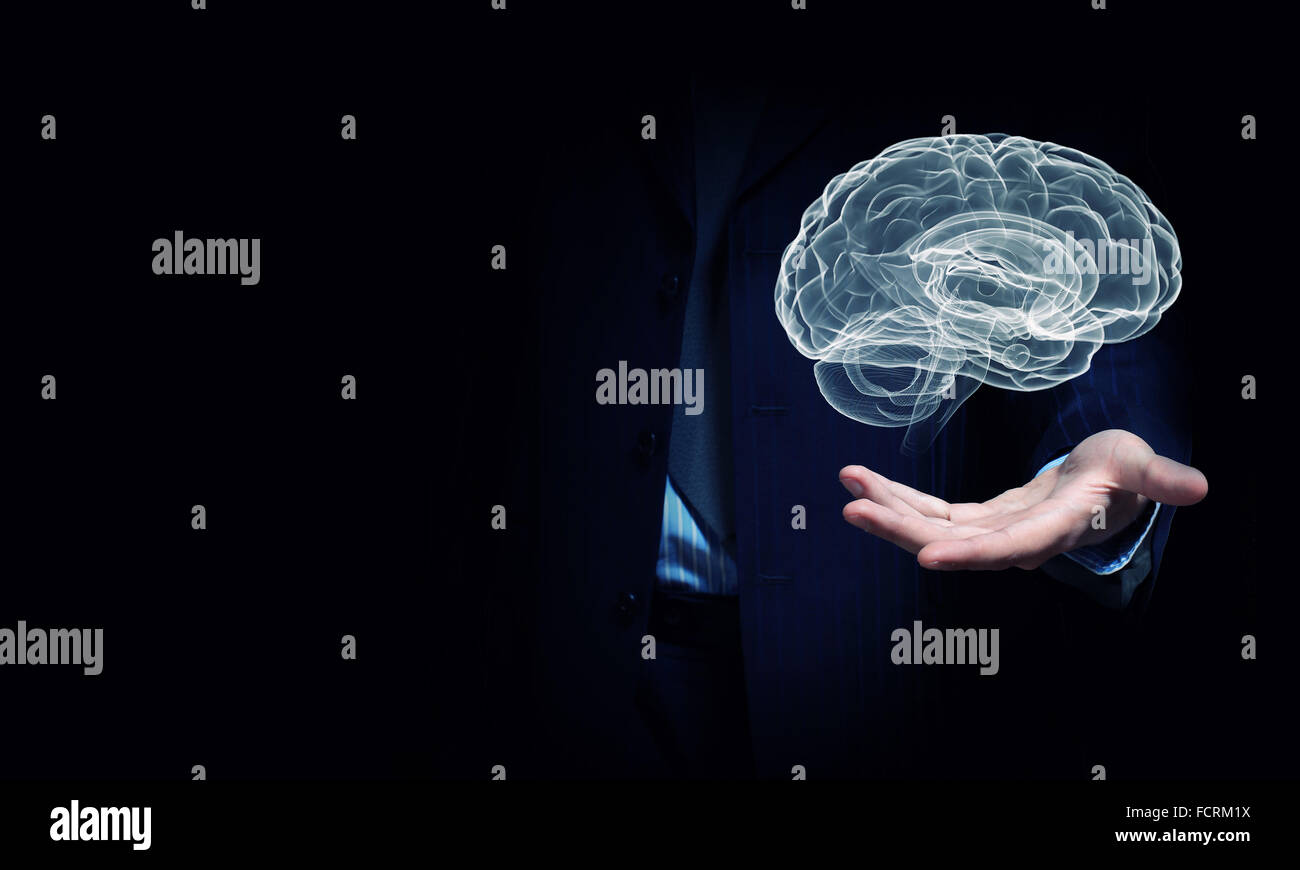 Close up of businessman hand holding brain in palm Stock Photo - Alamy