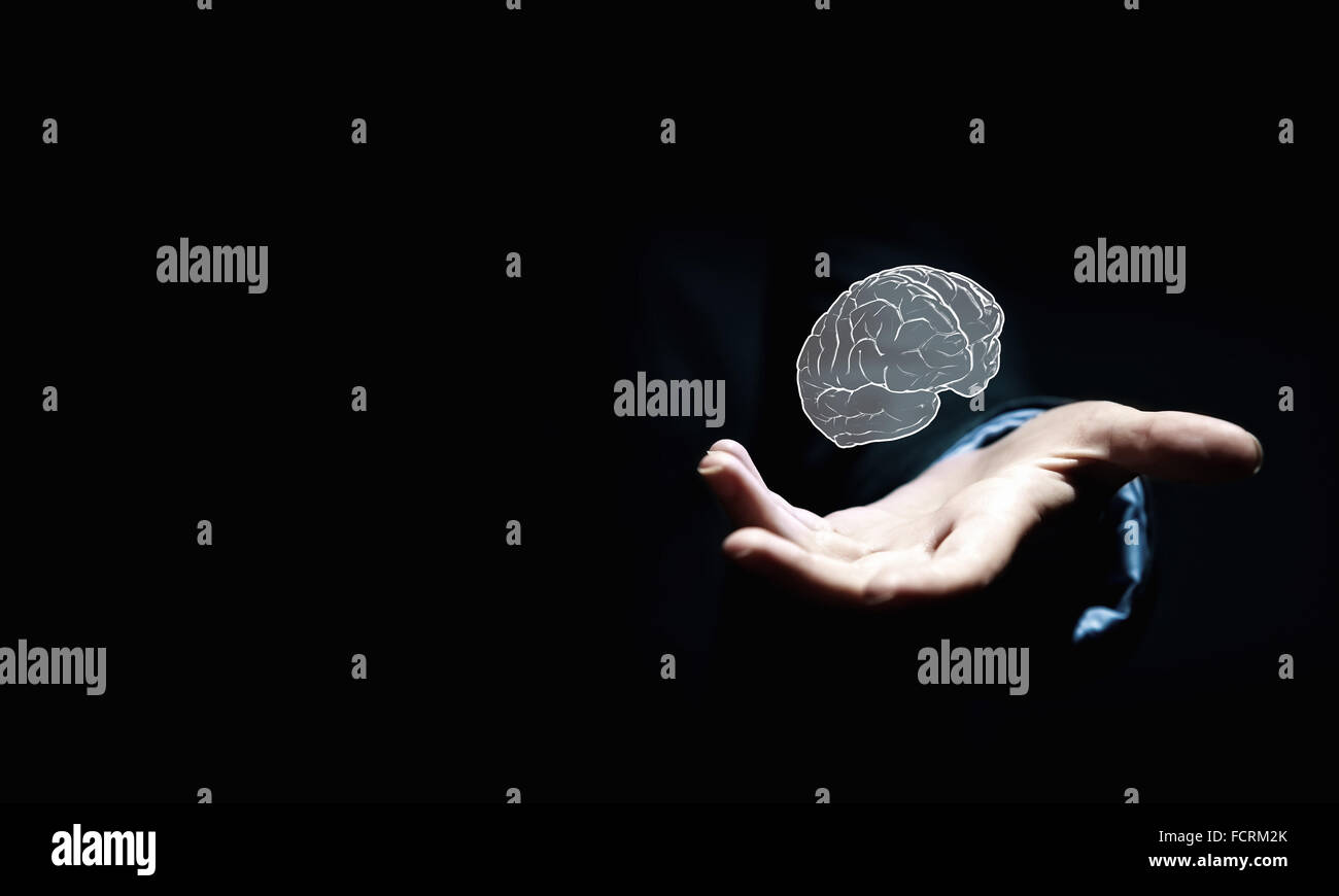 Close up of businessman hand holding brain in palm Stock Photo - Alamy