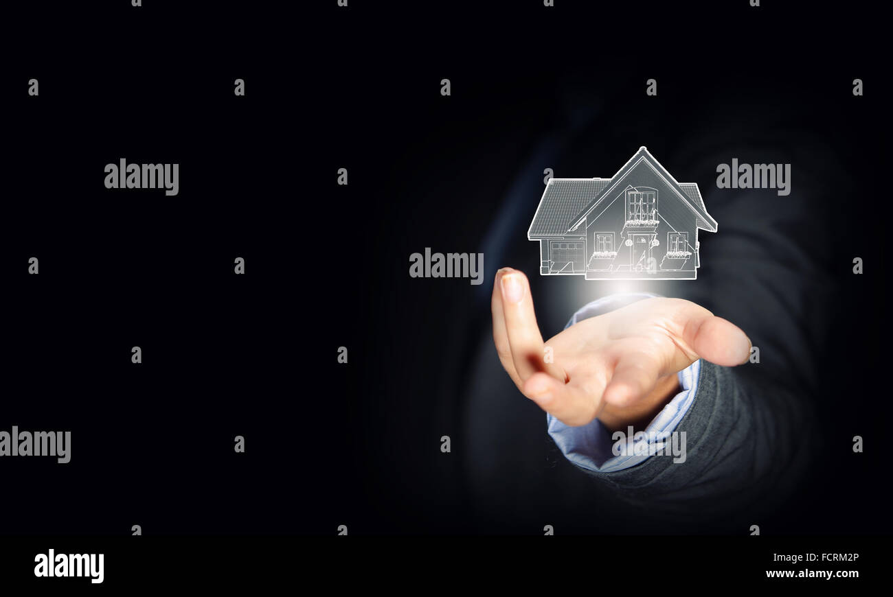 Close up of businessman hand holding house model Stock Photo - Alamy