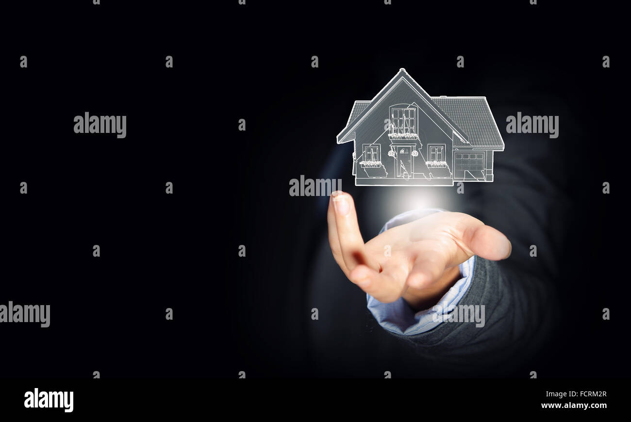 Close up of businessman hand holding house model Stock Photo - Alamy