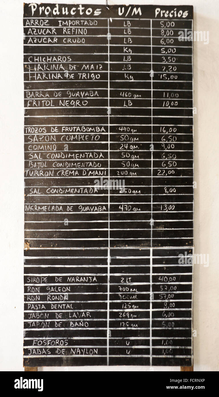 Board listing products for sale at government store (bodega) where ration cards are used, Vedado district, Havana, Cuba Stock Photo