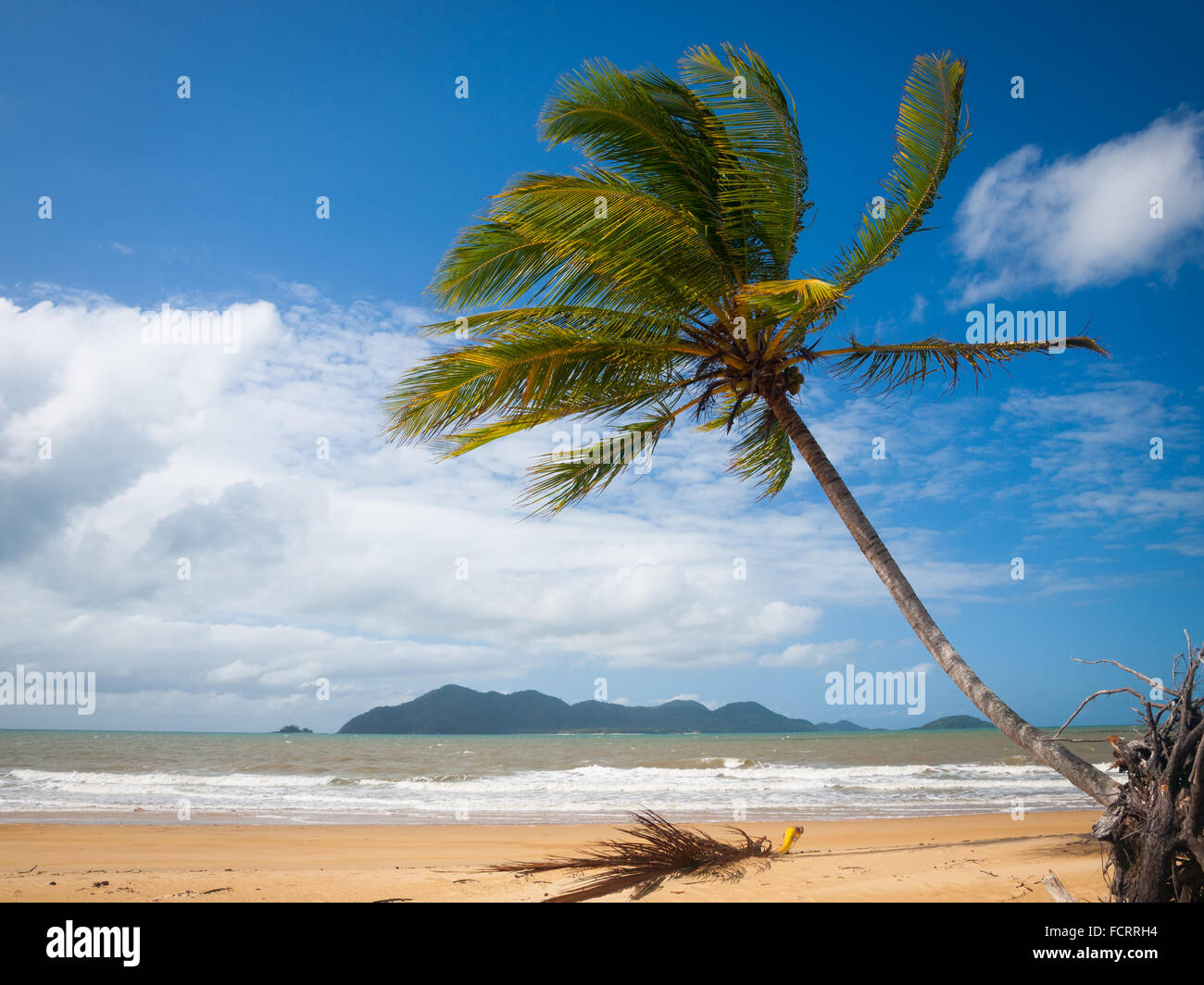 A view of the brilliant beach at South Mission Beach, Queensland, Australia. Dunk Island is in the distance. Stock Photo
