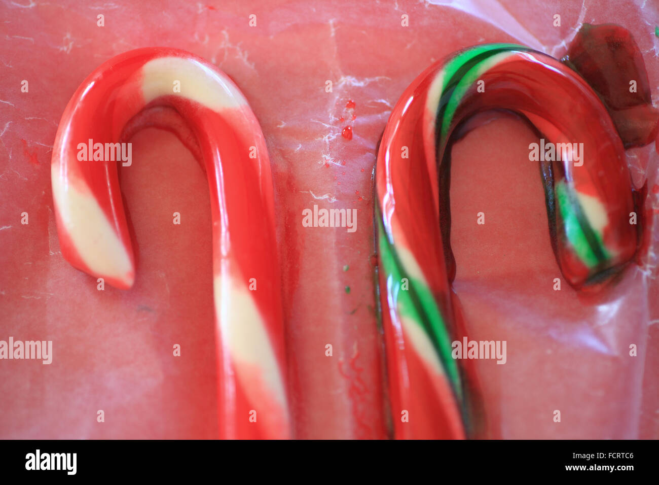 Candy canes on waxed paper starting to melt from humid weather Stock