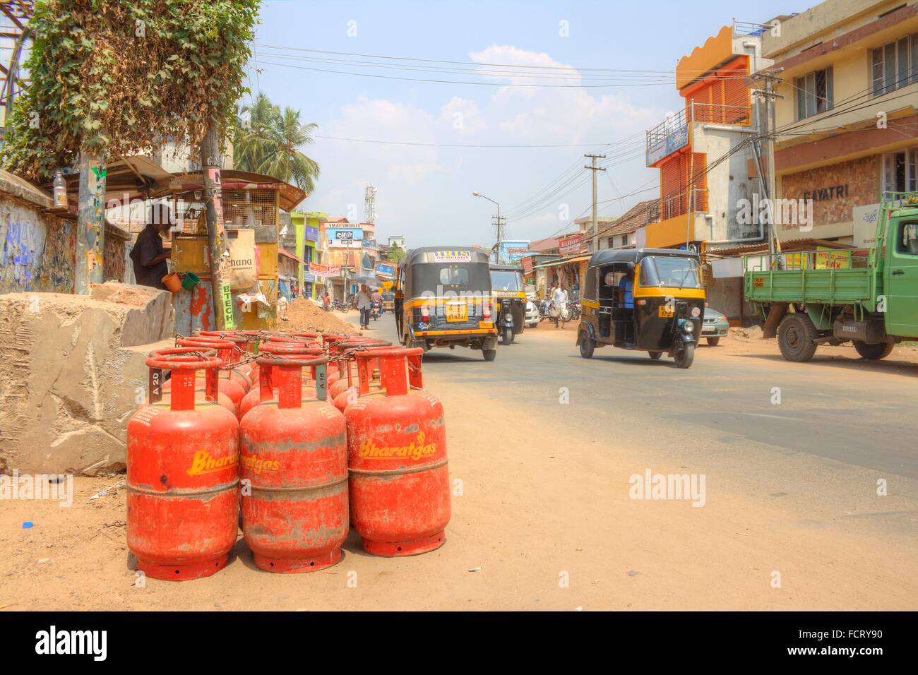 Street Scene with Gas Canisters, Rickshaws, Other Traffic, Trivandrum, Kerala, India Stock Photo