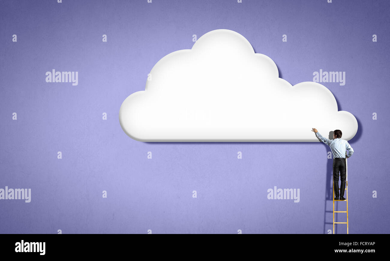 Back view of businessman standing on ladder and reaching to cloud Stock ...