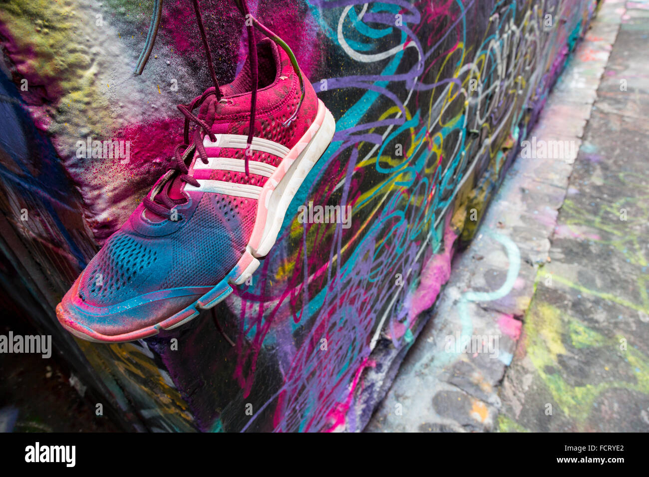 Painted shoe and Graffiti in one of Melbourne's most famous Laneways Hosier Lane Stock Photo