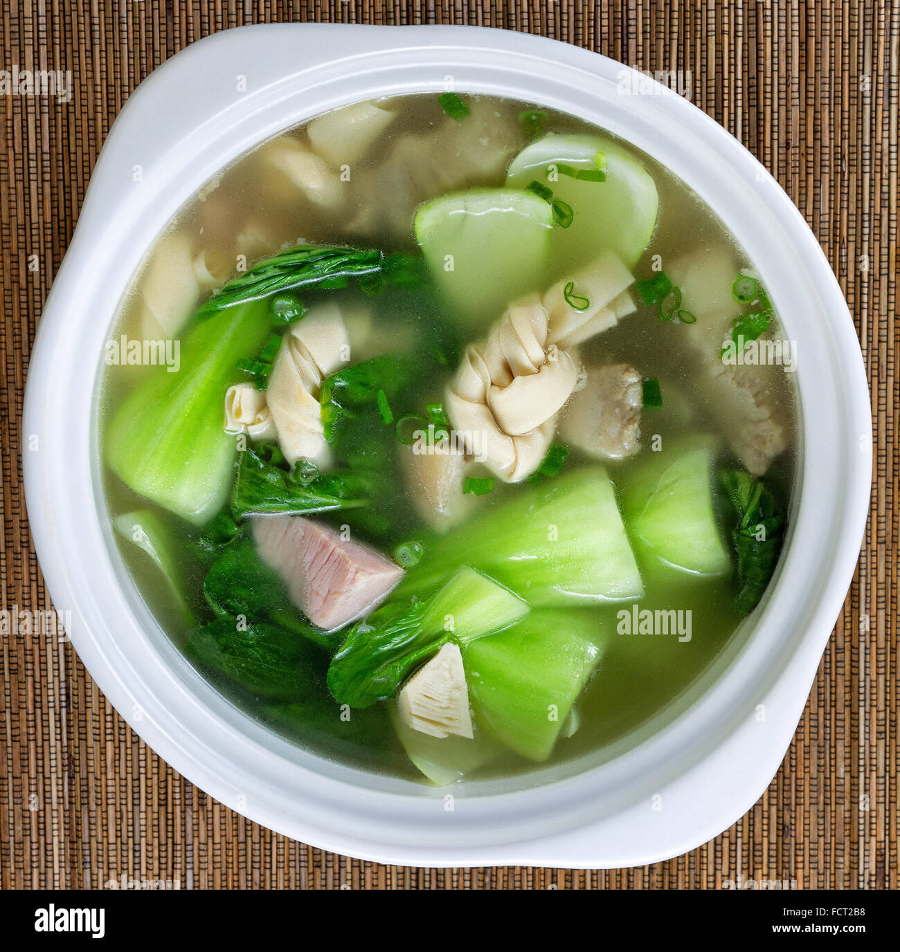 High angled view of Asian soup consisting of pork, dumpling and bok