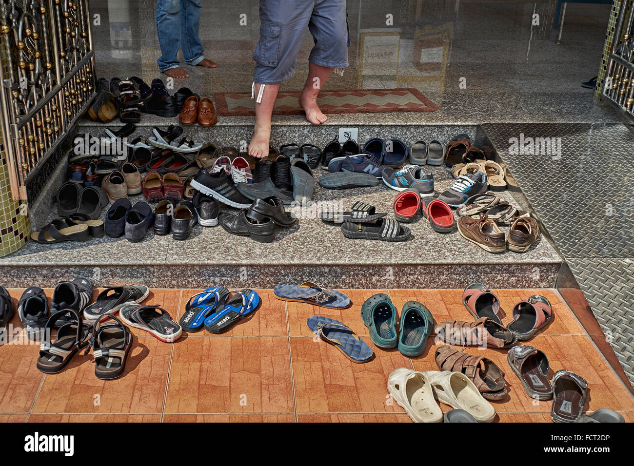 Footwear outside temple hi-res stock photography and images - Alamy