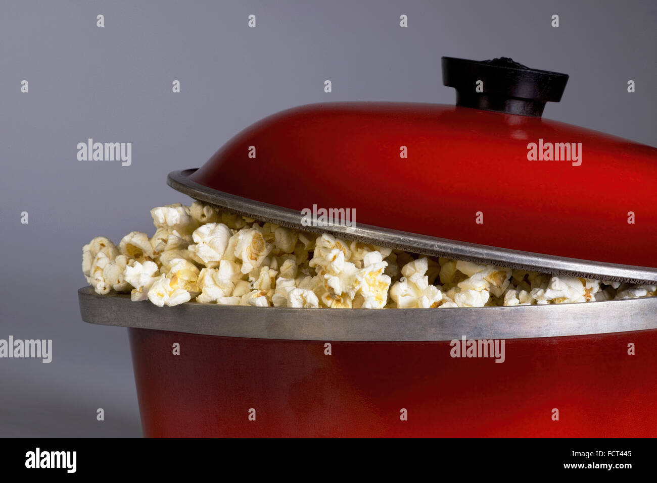 Making popcorn with an electric popper at home Stock Photo - Alamy