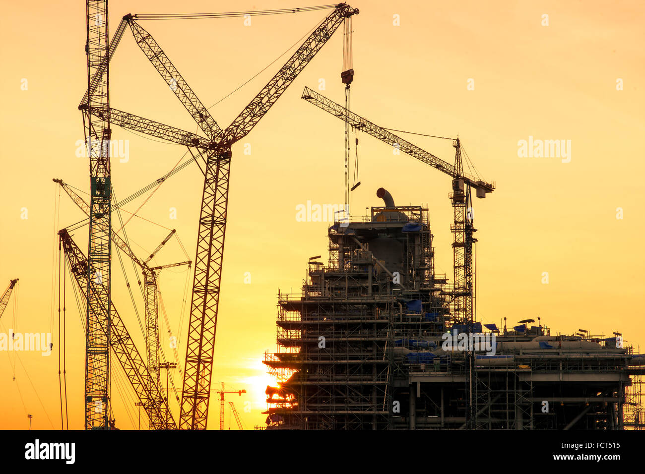 Lots of tower cranes build large residential buildings Stock Photo