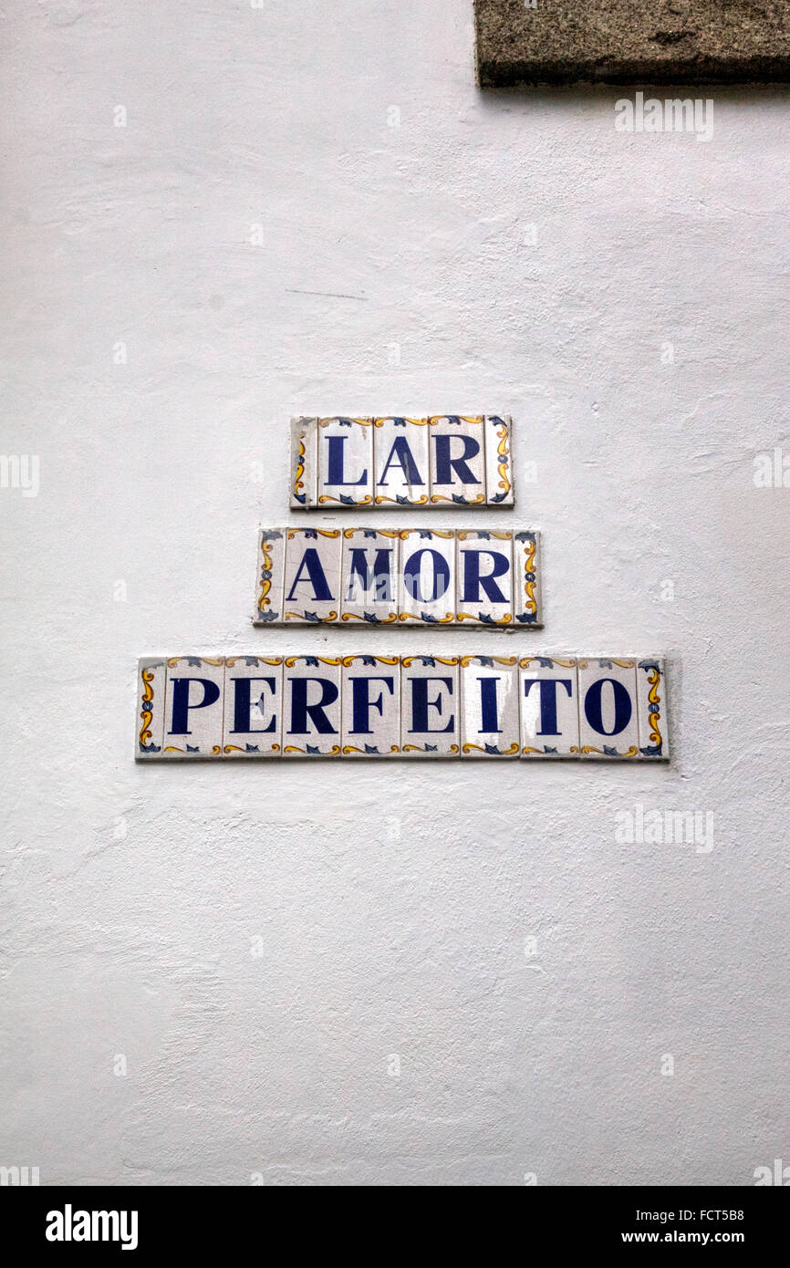 Decorative Street Sign tiles on White Wall reading 'LAR AMORE PERFEITO' in Portuguese ('The Perfect Love'), Porto, Portugal Stock Photo