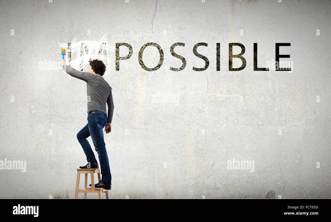 Businessman erasing impossible word hi-res stock photography and images ...