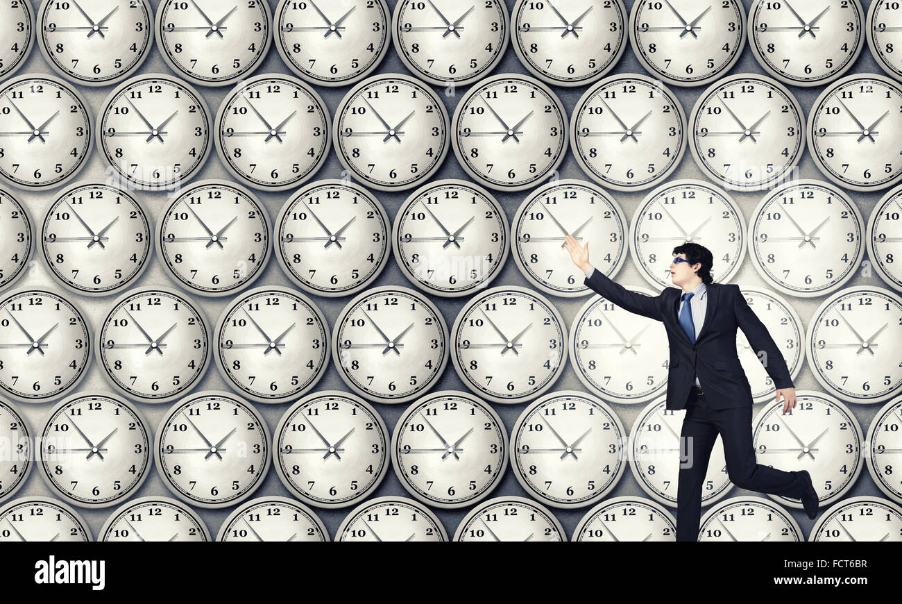 Concept of time with funny businessman running in a hurry Stock Photo ...