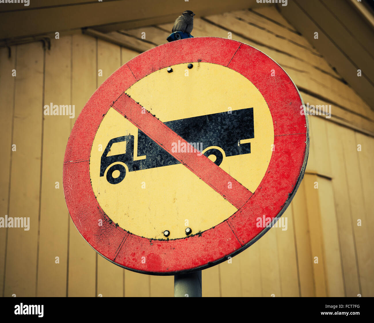 Example of the road sign 313 in Finland. No heavy goods vehicles. Vintage stylized photo with retro style tonal correction Stock Photo
