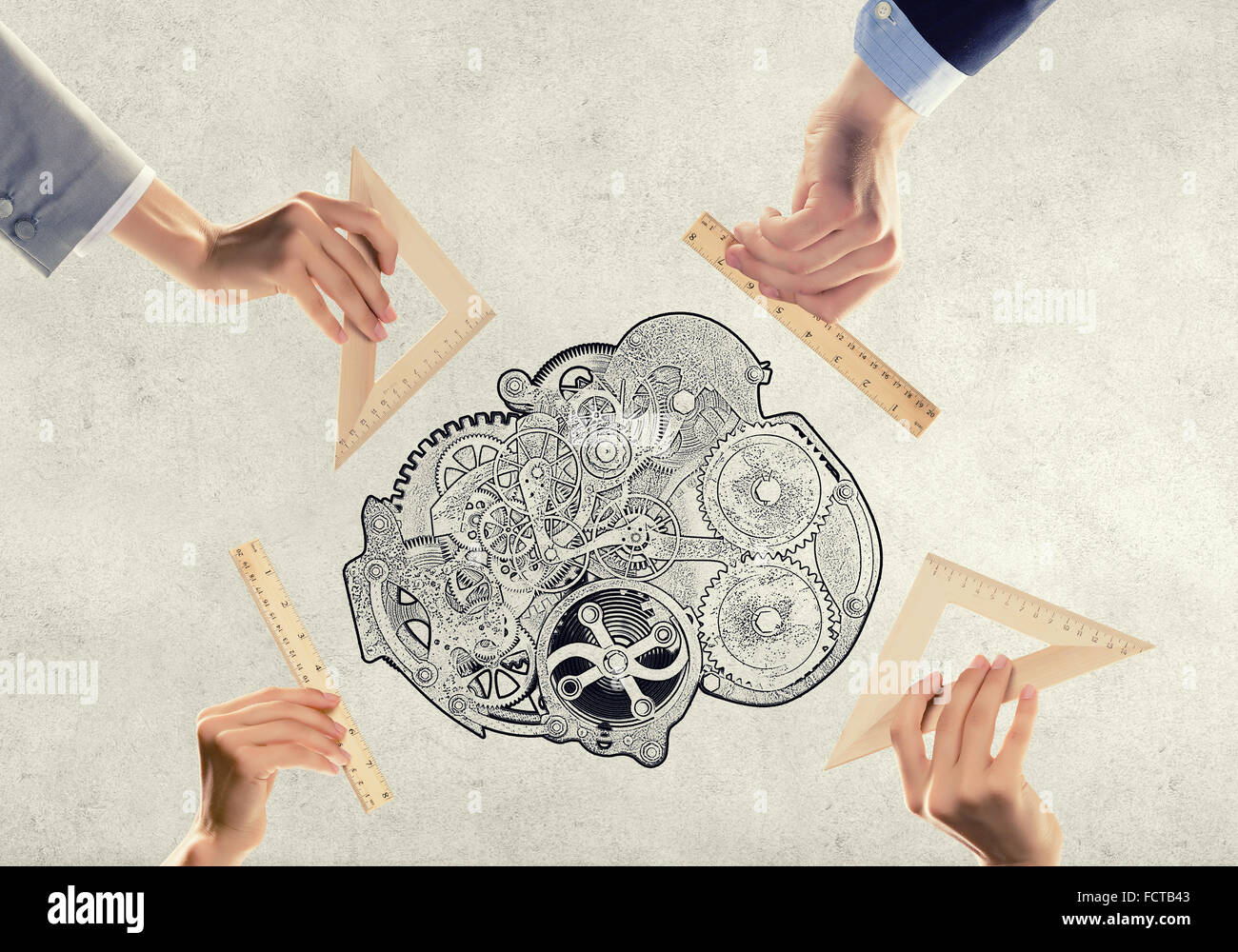 Human hands measuring gears mechanism with wooden rulers Stock Photo ...