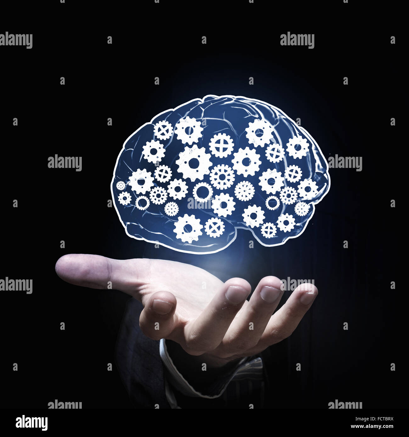 Close up of businessman hand holding brain in palm Stock Photo - Alamy