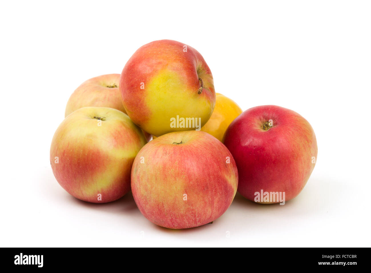five fresh juicy red and yellow apples isolated on white background ...