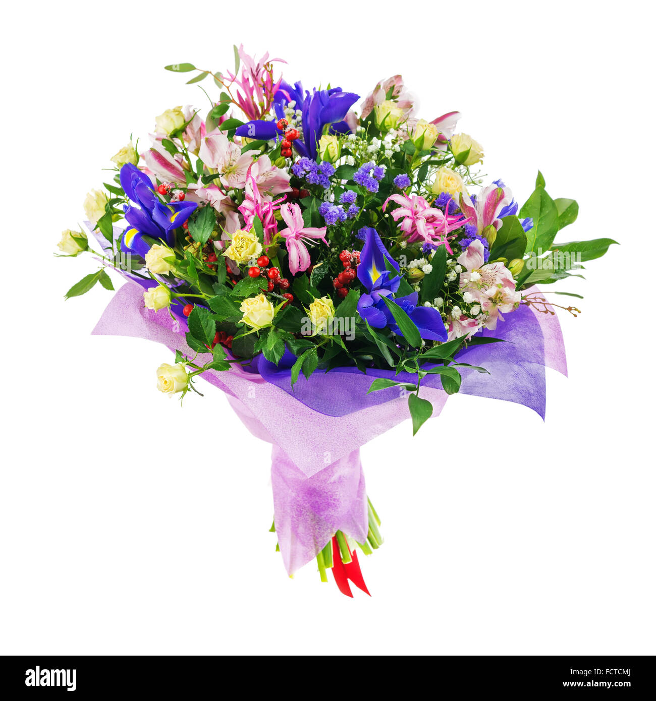 Delicate beautiful bouquet of nerine, iris, alstroemeria, roses and other flowers in pink packaging with red tape isolated on wh Stock Photo