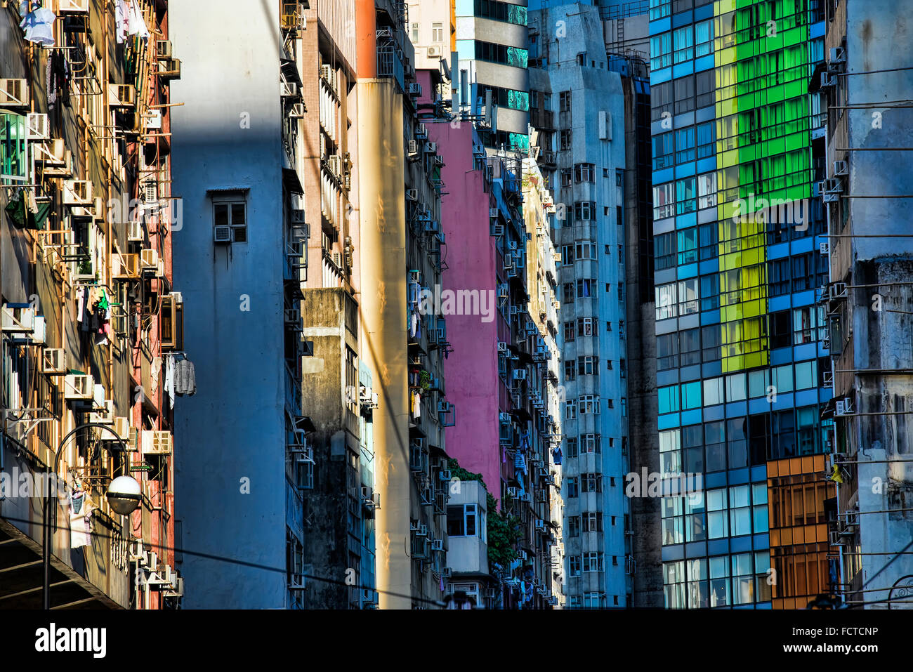 Exteriors of over crowded old buildings and new skyscrapers in Hong Kong, China. Stock Photo