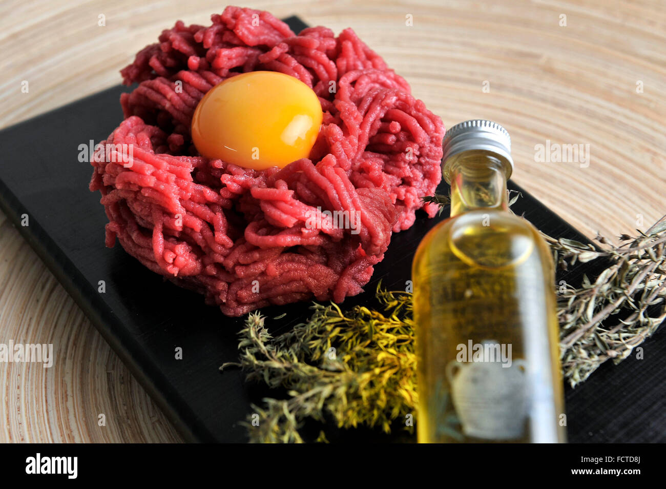 Steak tartare and raw egg yolk Stock Photo Alamy