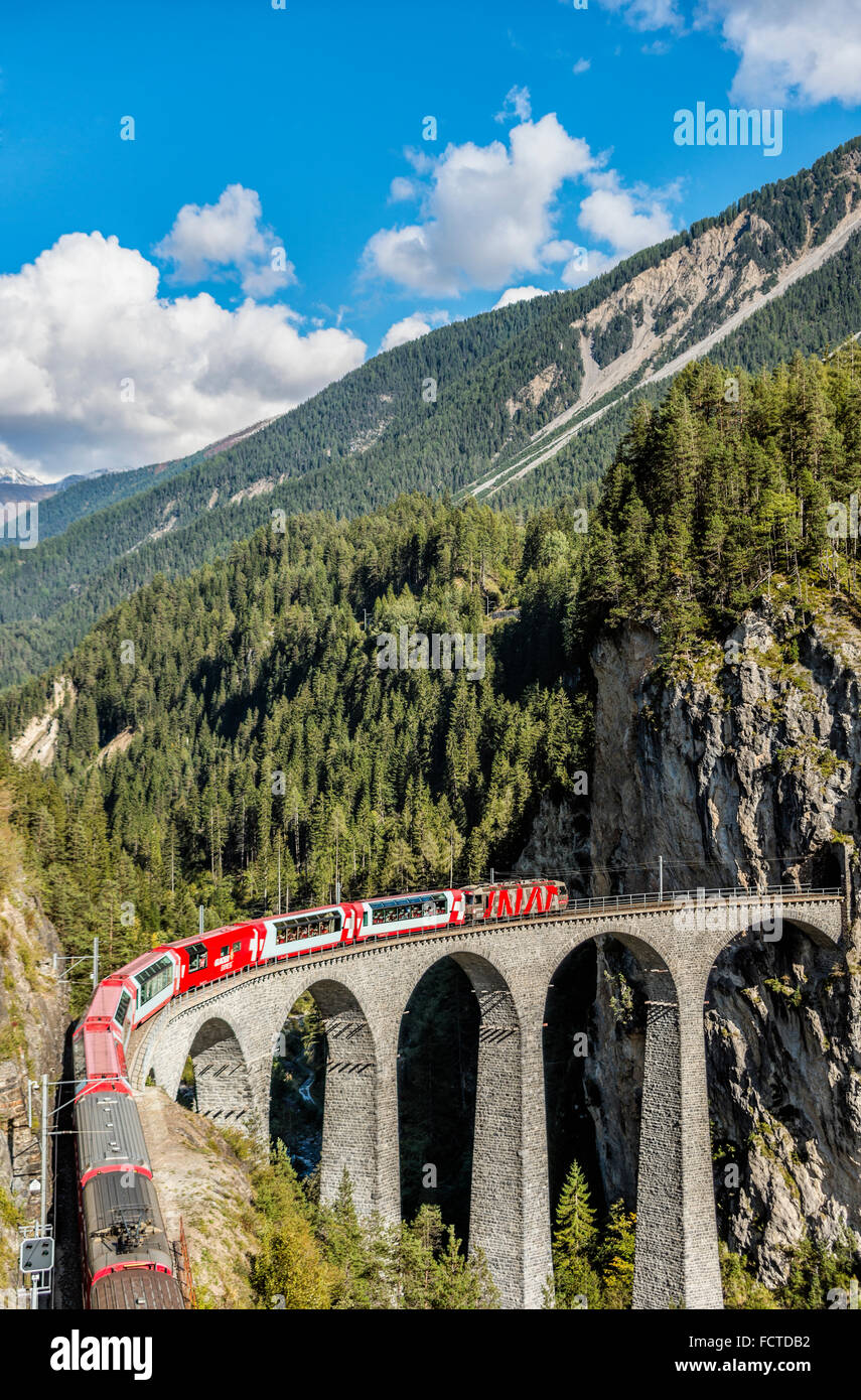 Glacier Express at the Landwasser Viaduct at Swiss Alps, Switzerland Stock Photo