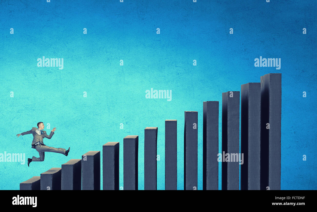Young businessman running up on staircase representing success concept ...