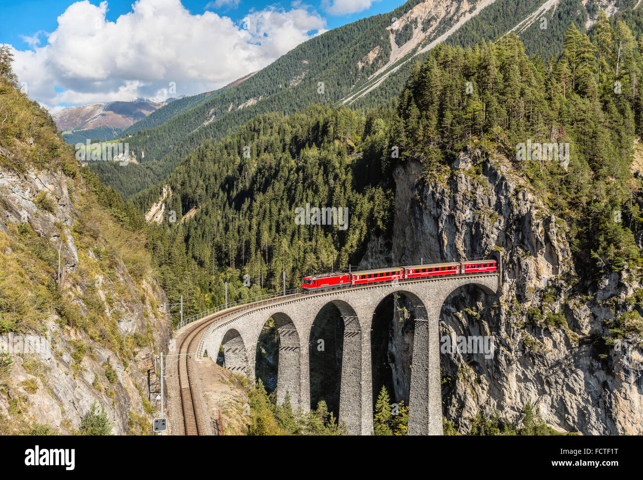Glacier Express at the Landwasser Viaduct at Swiss Alps, Switzerland Stock Photo