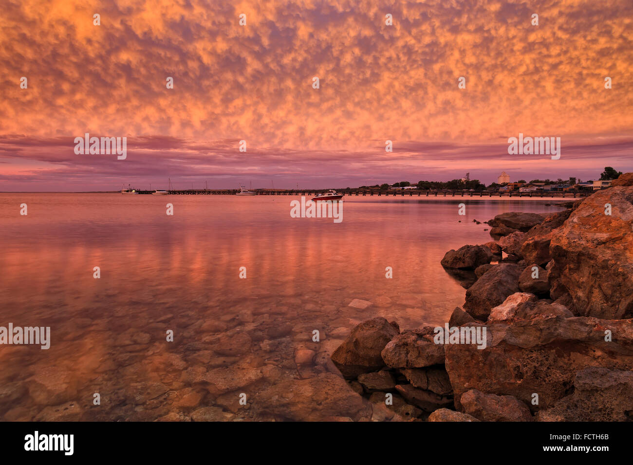 Magestic colourful sunset over still bay of Streaky Bay town in South Australia on Eyre peninsula with transparent water Stock Photo