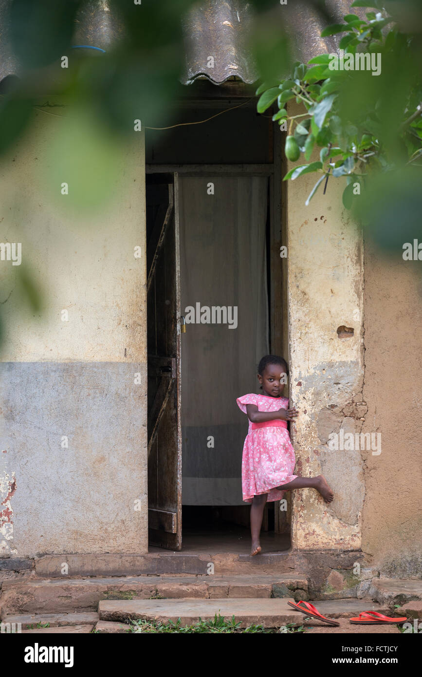 Girl outside their house in Kampala, Uganda, Africa Stock Photo