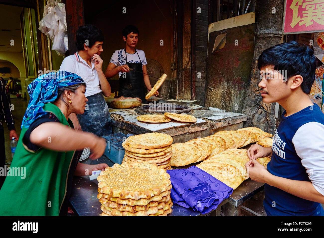 China, Shaanxi province, Xian, Hui neighborhood, food market, baker Stock Photo