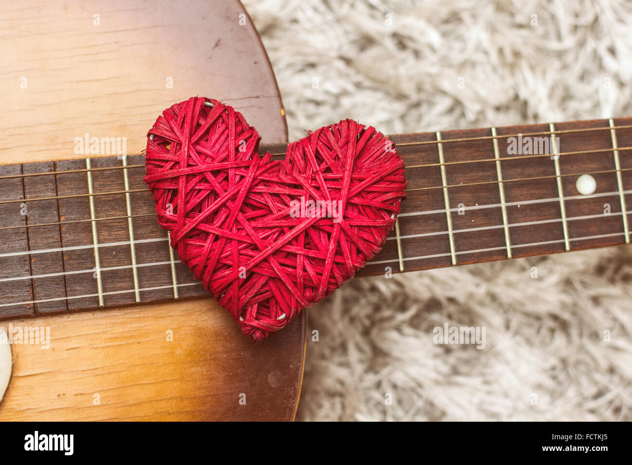 Love Red Heart on the guitar , romance and music, Valentine day Stock Photo  - Alamy